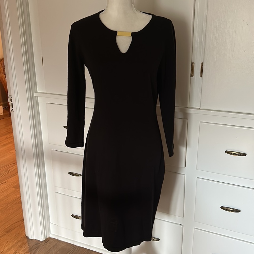 Calvin Klein little black sweater dress with gold embellishment.